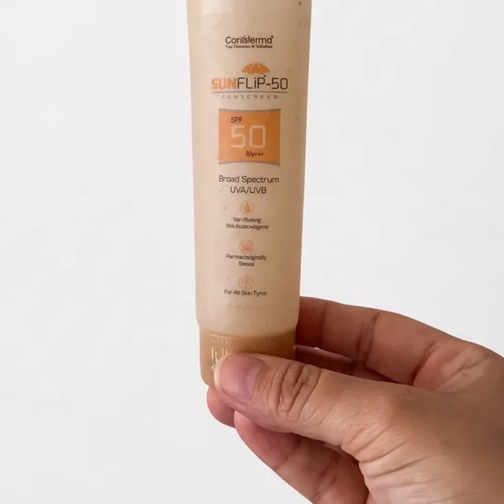 Printed bamboo biopolymer sunscreen tube held in hand